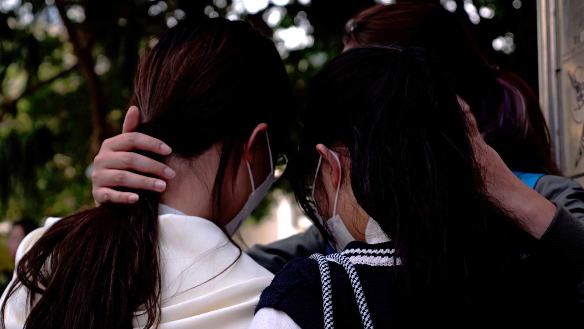 survivors-cling-to-each-other-as-debris-falls-from-smouldering-hong-kong-buildings